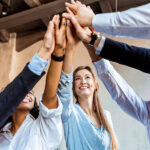business people slapping hands